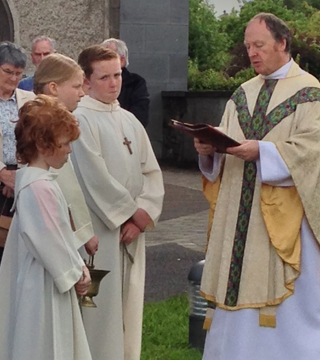 Altarboys and priest at St. Patrick's in Slane